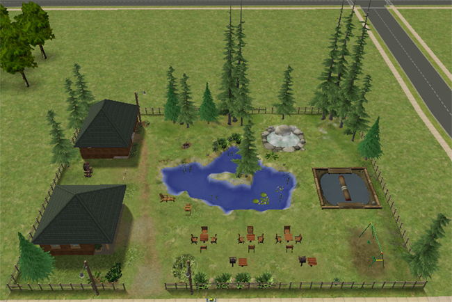 An overhead view of a Sims 2 country park with a pond, log rolling pit, campfire, playground, picnic seating, trees, and two cabin-style buildings.