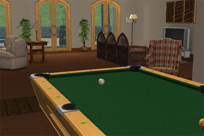 Interior family room view of Villa Marisa showing a pool table, arched glass doors, seating area, television, and spacious open living space.