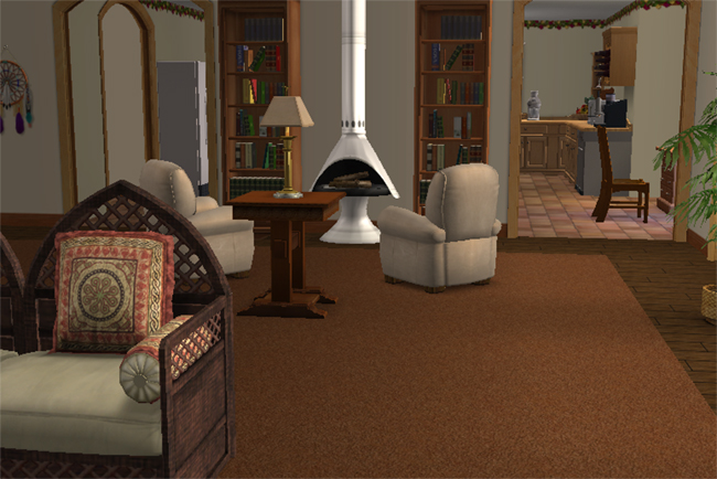 Alternate family room view of Villa Marisa featuring upholstered seating, central fireplace, bookcases, warm carpeting, and open access toward the kitchen.