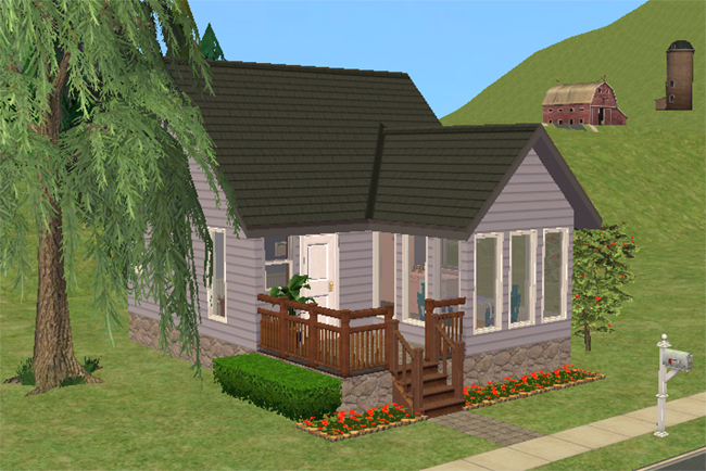 Front exterior view of Beatnik Bungalow, a small single-story cottage with pale siding, dark roofing, stone foundation, raised front porch, large front windows, and flowerbed landscaping.