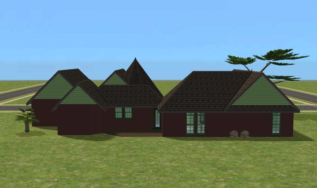 A rear view of Brandywine shows the long dark red exterior, pale green gable ends, green-trimmed windows, varied roof sections, and simple yard space behind the house.