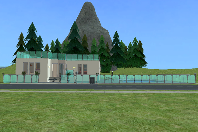 Street-level exterior view of the Chianti house showing broad patio space, glass fencing, modern flat rooflines, and a large private pool set against a mountainous backdrop.