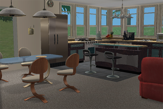 Interior view of the Chianti house featuring a modern kitchen with curved counters, large surrounding windows, contemporary dining furniture, and open living space design.