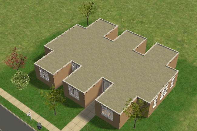 Exterior aerial view of Gigachip, a computer chip-shaped modern home with recessed entry sections, flat roofing, and symmetrical wing-like room layouts surrounded by simple suburban landscaping.