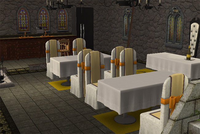 A medieval dining hall with long tables, white chairs, stone walls, arched windows, and fireplaces along the room.