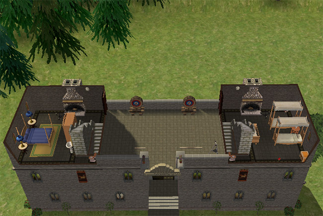 An overhead view shows two separate tower bedroom areas with stone walls, staircases, fireplaces, and an open space between the towers.
