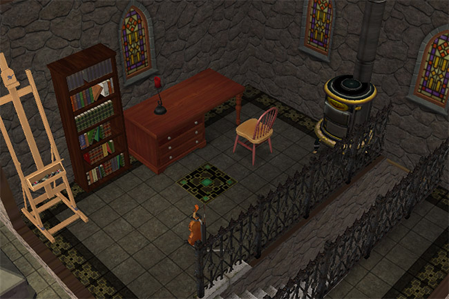 A small tower room with an easel, violin, bookcase, desk with a red candle, desk chair, fireplace, gothic windows, railing, and dark tiled flooring.