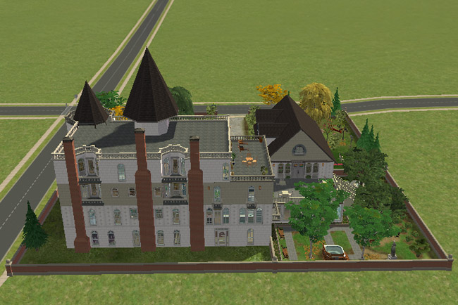 An angled rear view shows the large hotel, added rooflines, walled grounds, trees, patios, outdoor seating, a hot tub, and garden areas around the building.
