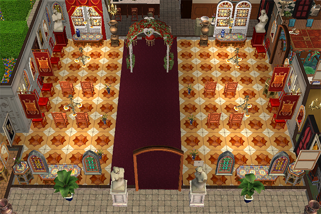 Grand entry view of Greystoke showing a massive ceremonial hall with red carpet aisle, decorative arches, statues, stained glass windows, and symmetrical dining seating arrangements.