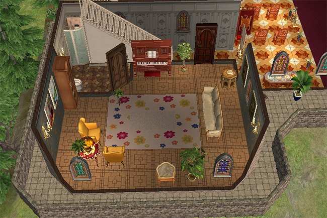 Interior sitting room view of Greystoke featuring stained glass windows, ornate wall paneling, floral rug, upright piano, and staircase access beside a small bathroom area.
