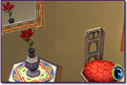 A vase with a red tulip, sitting on a table in front of a mirror with a chair next to it.