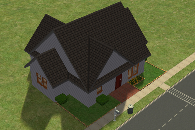 An angled exterior view of a grey Sims 2 house with a broad roofline, red front door, small landscaped yard, and room around the lot.