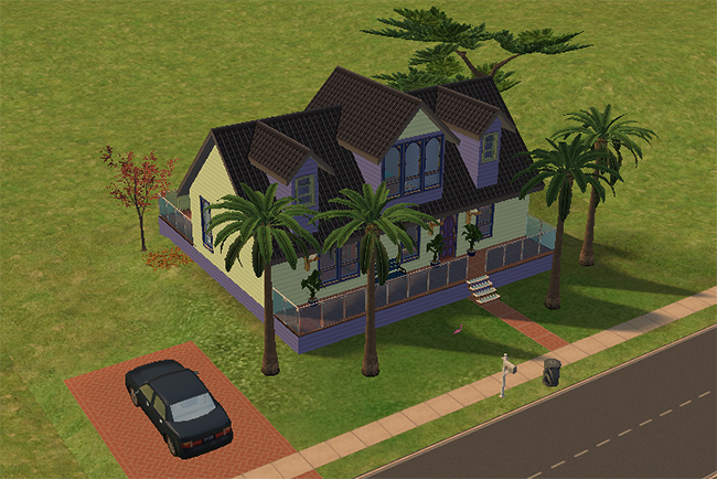 Angled exterior view of Western India showing the front porch, tall palm trees, brick driveway, dark rooflines, and large decorative upper windows.