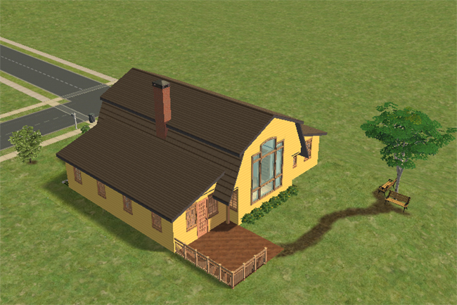The back of a yellow barn conversion house with a small fenced deck, side door, chimney, and a tree swing in the yard.