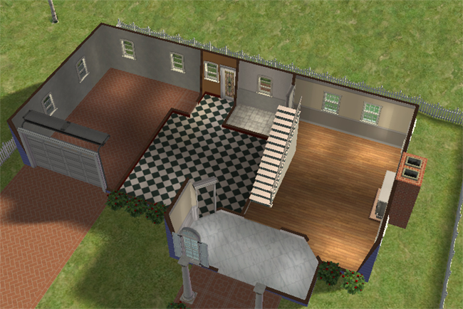 An angled exterior view of a blue barn conversion with a front porch, fenced yard, garage, dark rooflines, and red-trimmed windows.