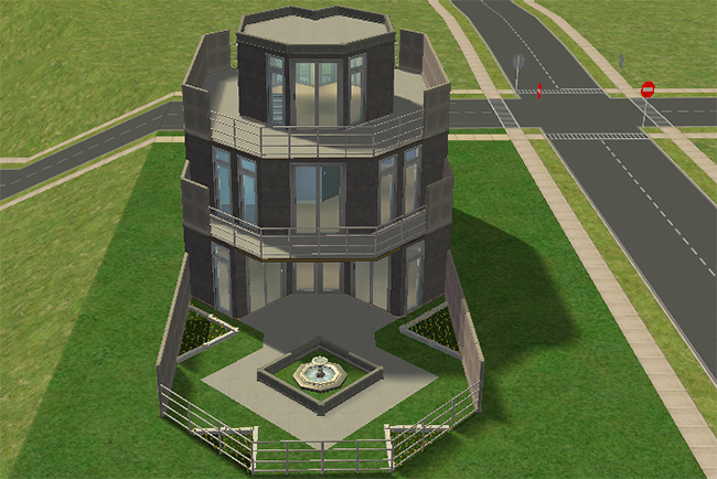 Rear exterior view of the City Terrace home showing layered balconies, curved modern walls, fenced patio space, and a central decorative fountain.