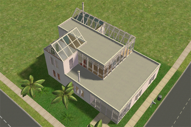 Front exterior view of Executive 2, a modern two-story home with white walls, flat roof sections, glass roof framing, palm trees, and large contemporary windows.
