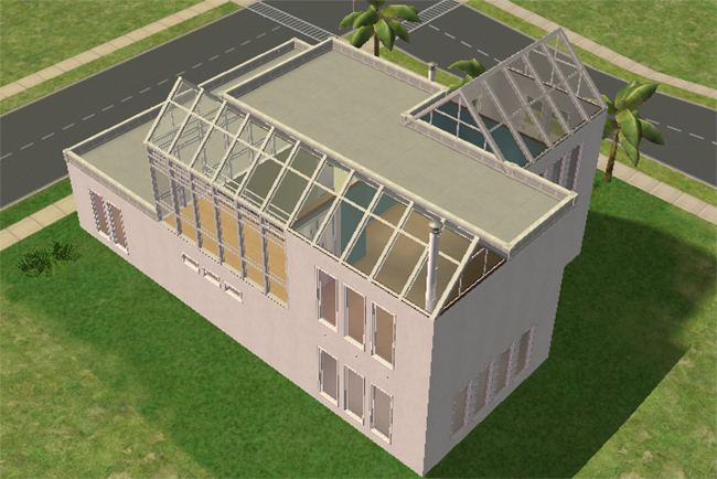 Rear exterior view of Executive 2 showing multiple glass-roofed sections, large window walls, flat modern rooflines, and a clean rectangular structure on a spacious lot.