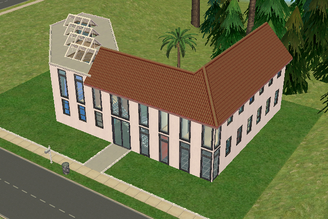 Front exterior view of the Lone Palm house featuring tall modern glass walls, contrasting rooflines, angular architecture, and a large central courtyard layout.