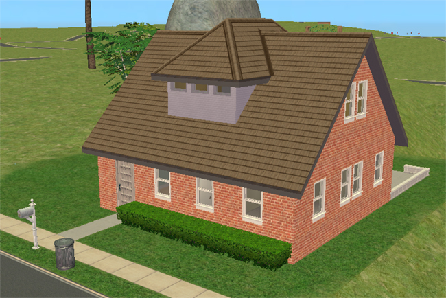Front exterior view of a compact brick two-story home with a steep roofline, central dormer, white upper accent section, front hedges, and simple suburban landscaping.