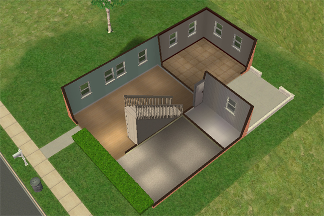 Cutaway first floor view showing an open unfurnished layout with staircase access, tiled kitchen area, broad living space, and a small rear patio.