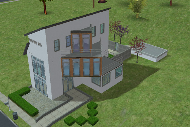 Angled front view of the postmodern house showing stacked balconies, large glass doors, and a side terrace connected to the upper level.