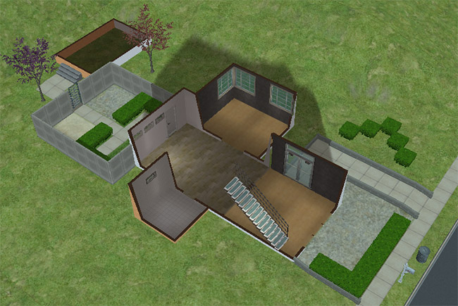First floor layout with a broad entry area, staircase, bathroom, and open rooms leading toward the fenced courtyard and outdoor space.