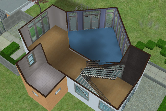 Second floor layout with a large open room, a wall of windows and glass doors, an additional bathroom, and access to an upper balcony.