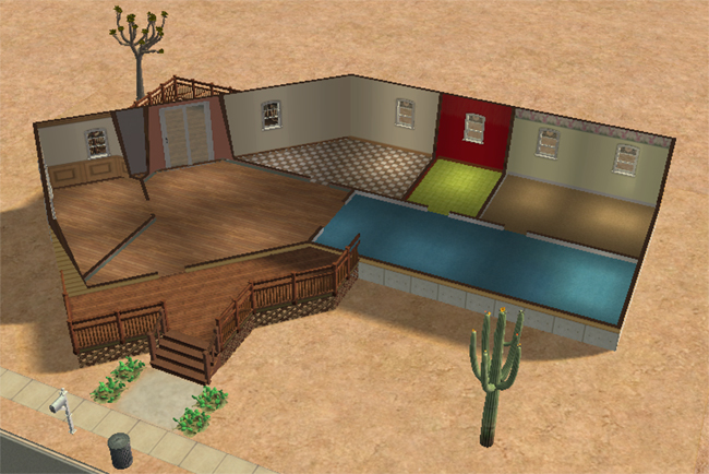 An overhead floor plan of an unfurnished desert home with two bedrooms, one bathroom, open living areas, a kitchen space, decks, and sandy yard space.