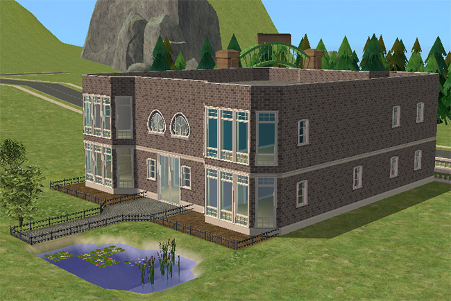The rear of a two-story brick home with tall windows, small decks, fenced yard sections, a pond, trees, and a rooftop railing.