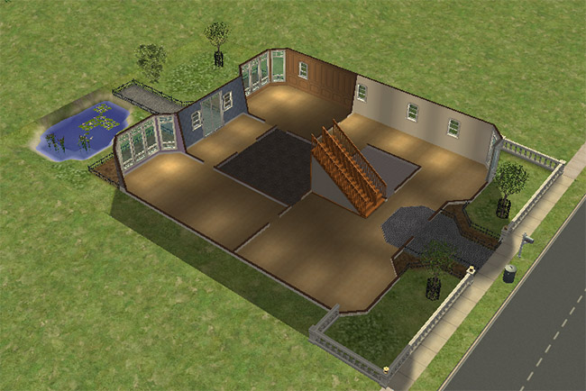 An overhead first floor view of an unfurnished home with large open rooms, bay windows, a central staircase, entry areas, and a pond beside the lot.