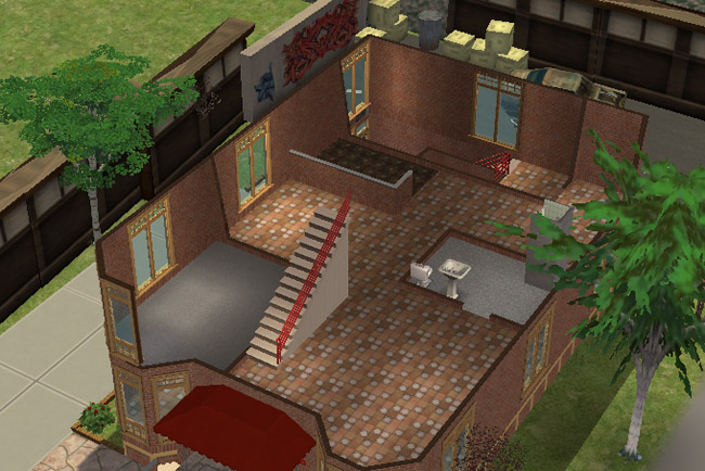 A cutaway view of the second floor shows tiled open space, stairs, bathroom fixtures, large windows, and access toward the back of the building.