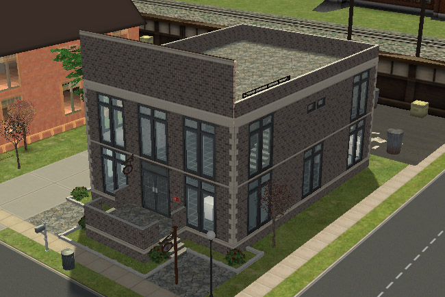 An angled view shows the brick building with large windows, a raised entry, a flat rooftop area, and sidewalks along two sides of the lot.