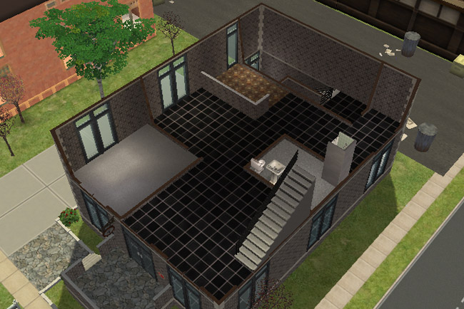 A cutaway view of the second floor shows a mostly open layout with a bedroom area, bathroom fixtures, stairs, and space for business or living use.