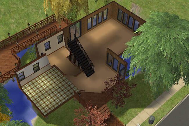 A cutaway view of the first floor shows an unfurnished layout with a large main room, tiled kitchen area, staircase, deck access, and surrounding water.