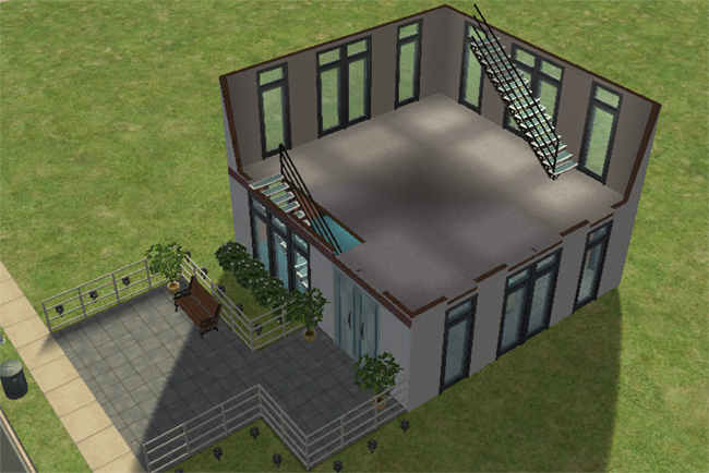 The second floor of a Sims 2 city house with an open unfurnished room, large windows, stairs, and access down to the first floor.