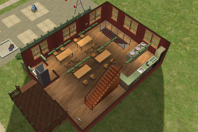A cutaway view of the first floor shows a cafeteria-style space with tables, benches, a buffet counter, sinks, bathrooms, and stairs.