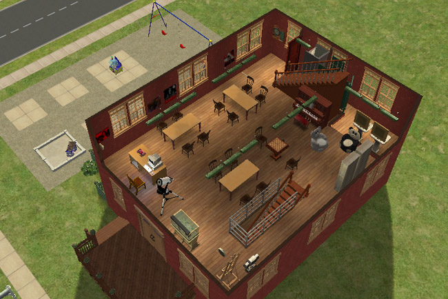 A cutaway view of the second floor shows activity areas, tables, a piano, easels, exercise equipment, and stairs leading upward.
